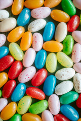 Colorful candy beans as texture and background. Close up view of jelly beans with selective focus. 