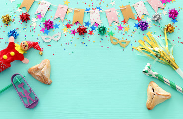 Obraz na płótnie Canvas Purim celebration concept (jewish carnival holiday) over wooden mint background