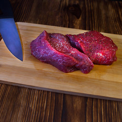 Man cutting beef meat.