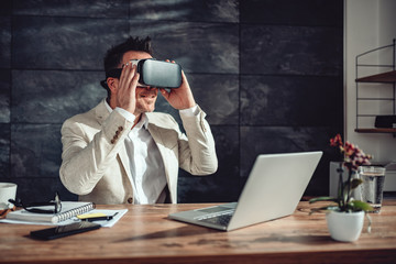 Businessman using virtual reality headset