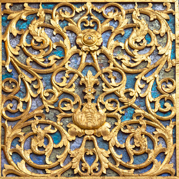 Ancient golden carving wooden door and wall of Thai temple. Thailand. And wall or door Palace.