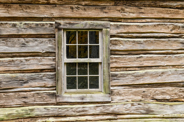 Naklejka na ściany i meble Old Window in Log Cabin