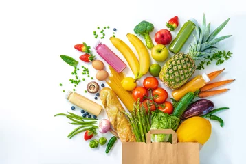Fotobehang Groenten Shopping bag full of fresh vegetables and fruits isolated on white  © Alexander Raths