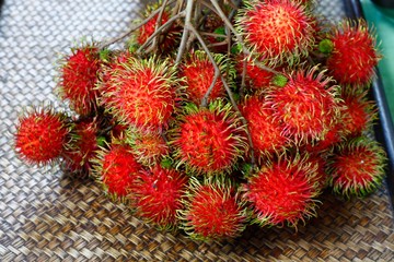 Naklejka na ściany i meble Rambutan, fruit in red color with hairy out and white inside