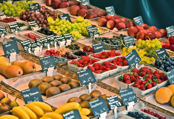 A lot kind and mixed of fruits with German name and price  in the market