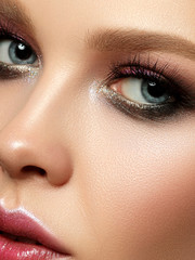 Naklejka premium Portrait of beautiful woman with fashion make up