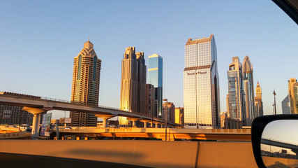 Naklejka premium Dubai skyline in sunset time, United Arab Emirates. warm sunny day