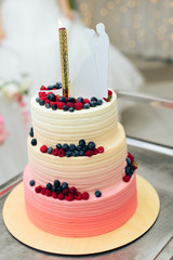 beautiful huge wedding cake with flowers and fruits