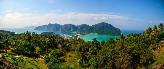 Fototapeta na wymiar Travel vacation background - Tropical island with resorts - Phi-Phi island, Krabi Province, ThailandBuddhist and Hindu motifs