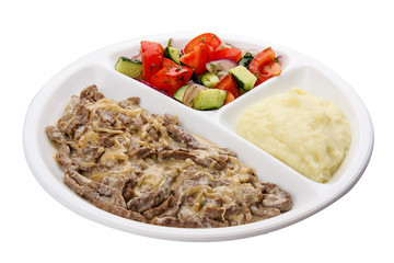 Beef Stroganoff with mashed potatoes and vegetables. Meals for children.