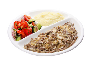 Beef Stroganoff with mashed potatoes and vegetables. Meals for children.