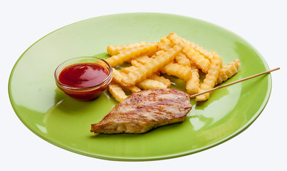 Grilled chicken fillet with French fries and sauce. Meals for children.