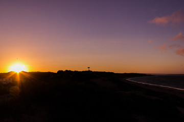 Natural Sunset Sunrise over a beach with birds at the sun, Western australia