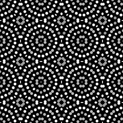 Seamless abstract pattern background with a variety of colored circles.