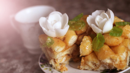 national dish chuck chuck with cream flowers and a cup of tea