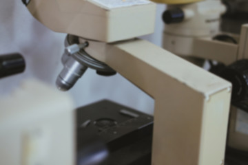 microscope for examining test sample in laboratory. blur background