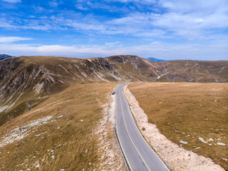 Aerial view on transalpina road on Romania mountain, travel, adventure concept, motorcyclists way, vacation place, mountains top, autumn day