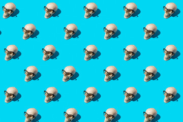 skull pattern with glasses on a blue background