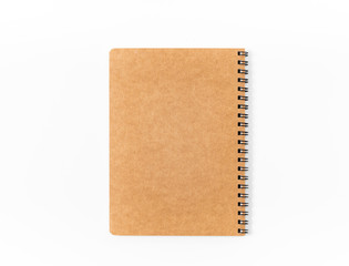 Brown spiral notebook isolated on white background.top view