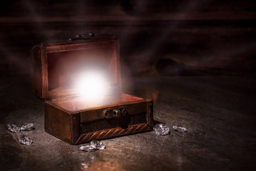pen old pirate chest and whte light from it, brilliants, treausres in chest, pirate mystery, old...