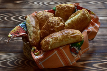 fresh home made tasty pastry in a plate on a dark wooden table