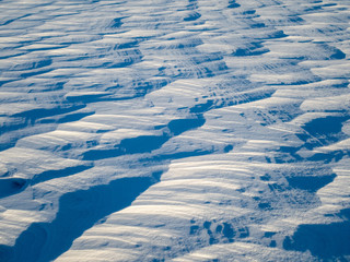 Patterns in the snow after a blizzard. Snow after a blizzard. Snow drift.