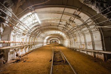 Underground gold ore mine shaft tunnel gallery with light