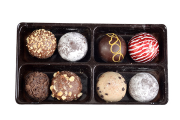 isolated top view handmade chocolates in a tray