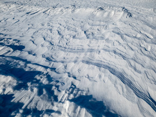 Patterns in the snow after a blizzard. Snow after a blizzard. Snow drift.