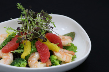 prawns and citrus frfuits salad in a serving bowl