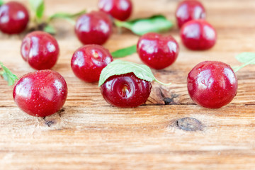 Fresh ripe cherry berries on wooden background