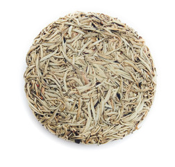 High quality white raw puer cake, pressed tree tips from Yunnan, China. Isolated on white.