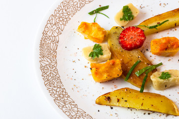 Roasted vegetable pieces.