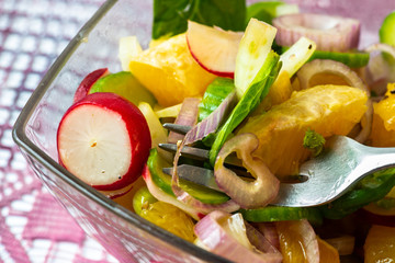 Vegetable and fruit salad in bowl.