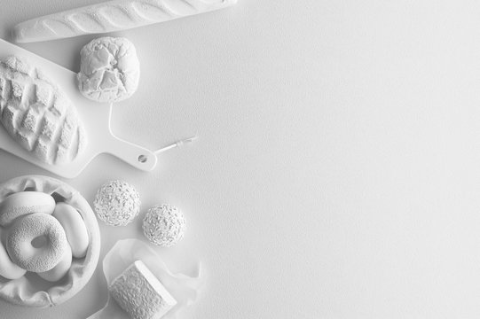 Monochrome composition of white figure of bread, long loaf, buns, bakery products on a white background. Banner with copy space for text. A set of food on the top view. 3D rendering.