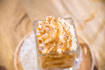 vanilla ice cream with chocolate lava  and Cereal on wooden table