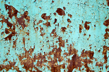 Rusty metal background with peeling blue paint