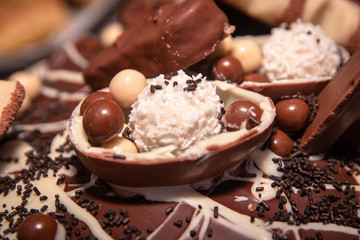 Chocolate, chocolate cookies and candies like a decoration on homemade cake