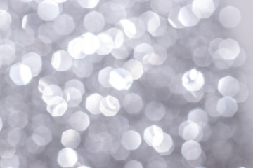 Silver glitter festive background with bokeh lights. Celebration concept for Holidays and anniversary.