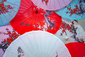 Ancient Japanese umbrellas placed in multicolored patterns,Old wooden umbrellas made of paper colorful art asian,Concept: Celebration of Chinese culture year new festival for tourism