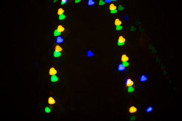 Colorful abstract heart shape blured bokeh at night