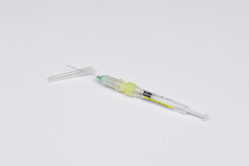 Single use syringe isolated on white