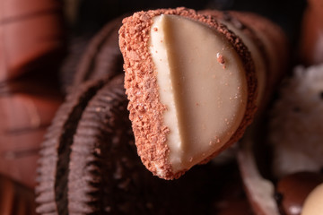 Chocolate, chocolate cookies and candies like a decoration on homemade cake