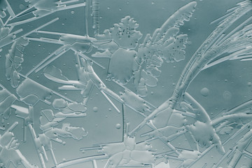 Snow patterns on glass as an abstract background