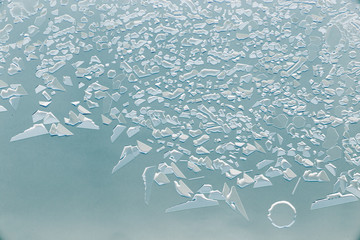 Snow patterns on glass as an abstract background