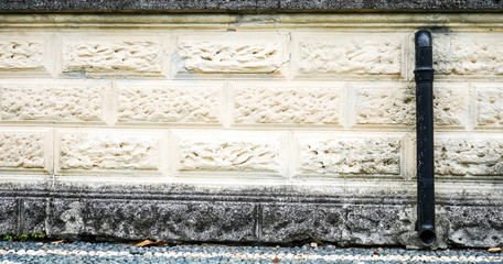 black gutter on a wall