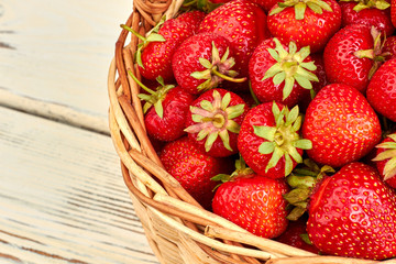 Ripe organic strawberries in basket. Sweet garden strawberries. Ripe fruits on farmer market.