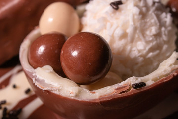 Chocolate, chocolate cookies and candies like a decoration on homemade cake