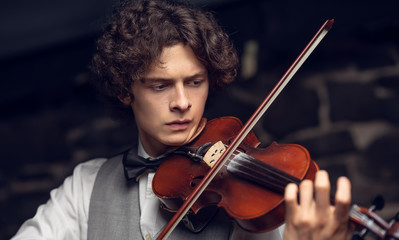 the guy is playing the violin