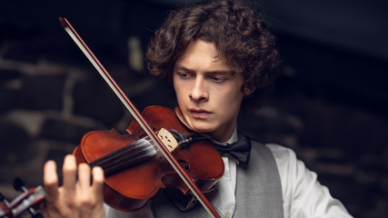 the guy is playing the violin © Maestro7